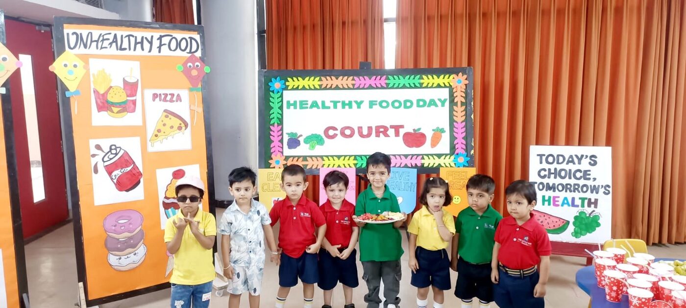 TLS Rohtak students showcasing healthy lunchbox meals on Healthy Food Day